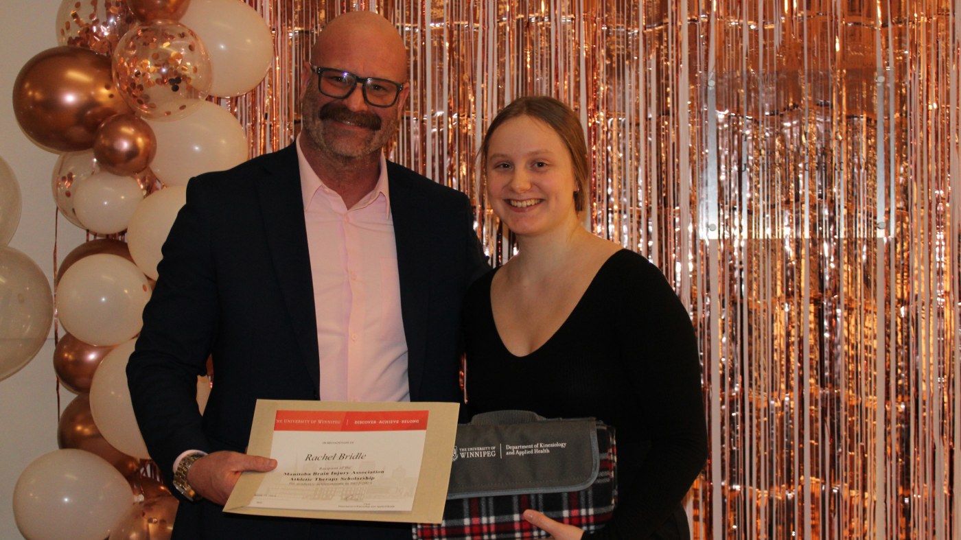 Student Rachel Bridle stands with Manitoba Brain Injury Athletic Therapy Scholarship