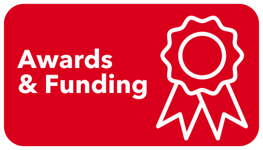 Icon of an award ribbon. White text reads "Awards and Funding"
